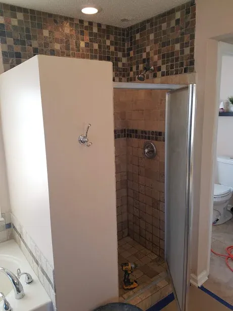 We took the wall out and the framed door. The homeowner had to duck his head to fit under the door frame. This thing was built before the sale of this house and looked and performed just well enough to sell the house.