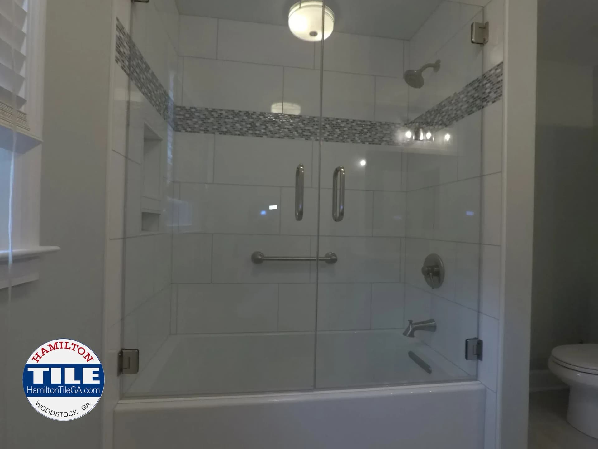 Look at those beautiful doors. This luxury bathroom remodel in Woodstock, GA is tremendous.
